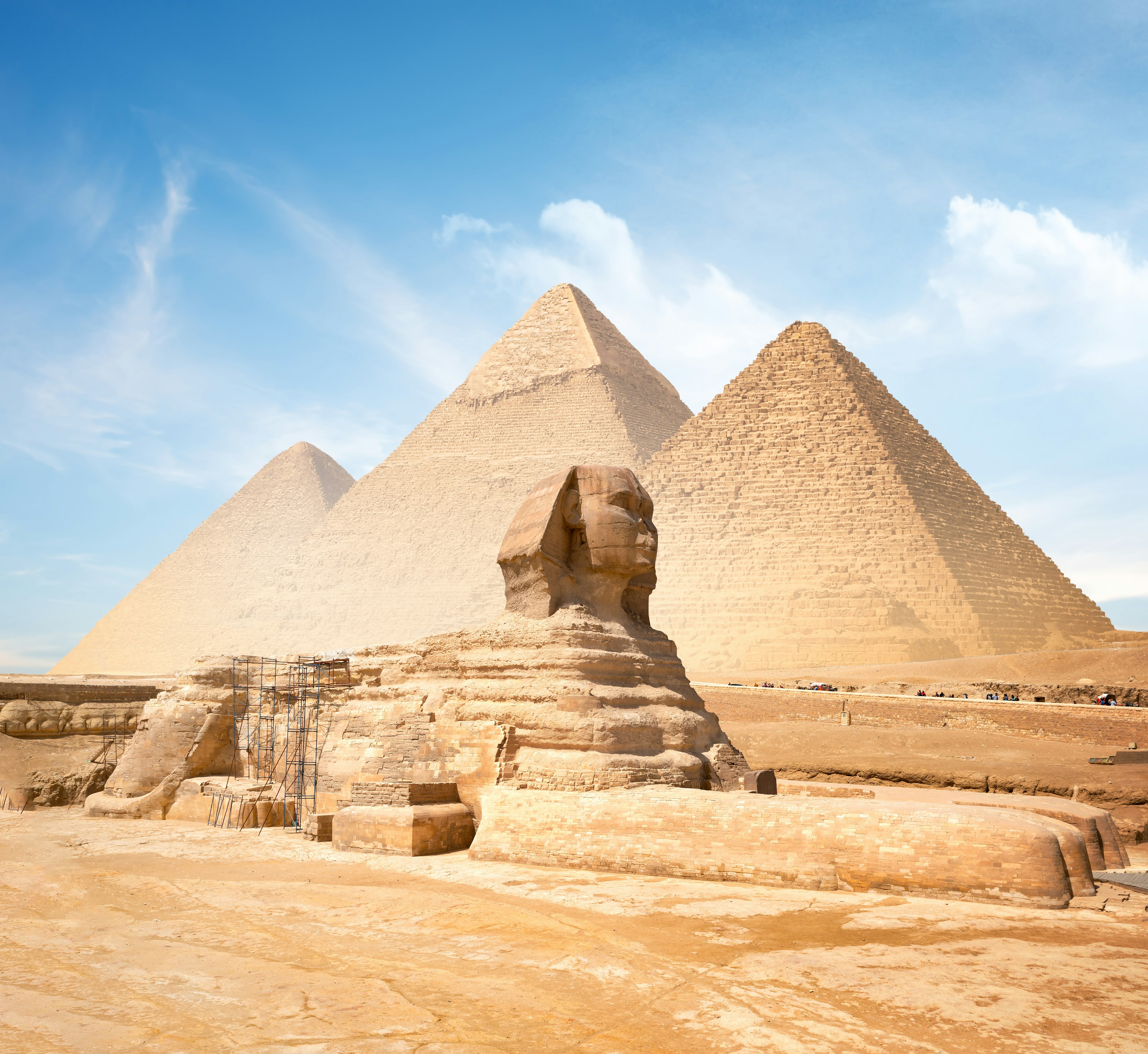 Great Sphinx of Giza and the Pyramids in the background on a clear sunny day