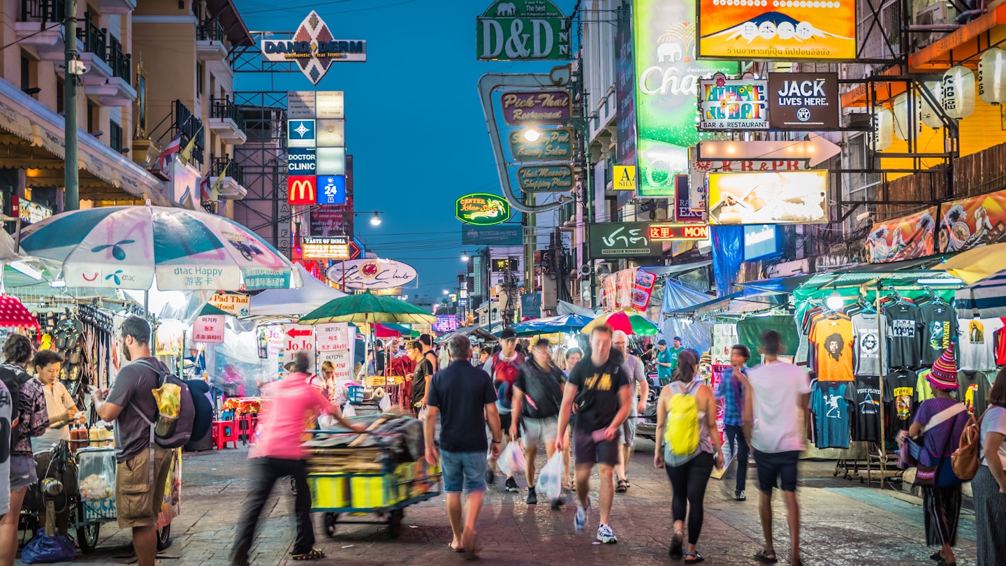 Bangkok, Thailand - Oct 5, 2019 : People with blur motion at Khao San Road, is a short street that has many shops sell handicrafts, clothes, barbecued insects and other exotic snacks for tourists.