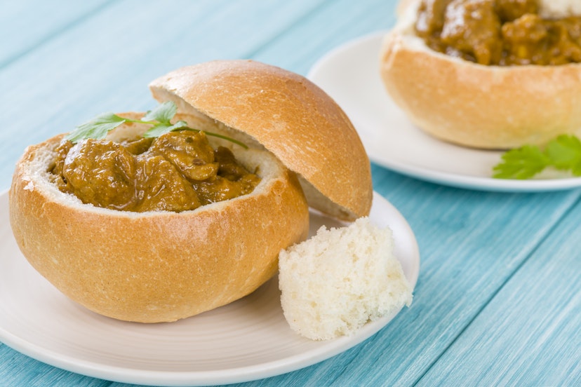 Bunny Chow - South African mutton curry served inside a hollow bread bun.