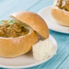Bunny Chow - South African mutton curry served inside a hollow bread bun.