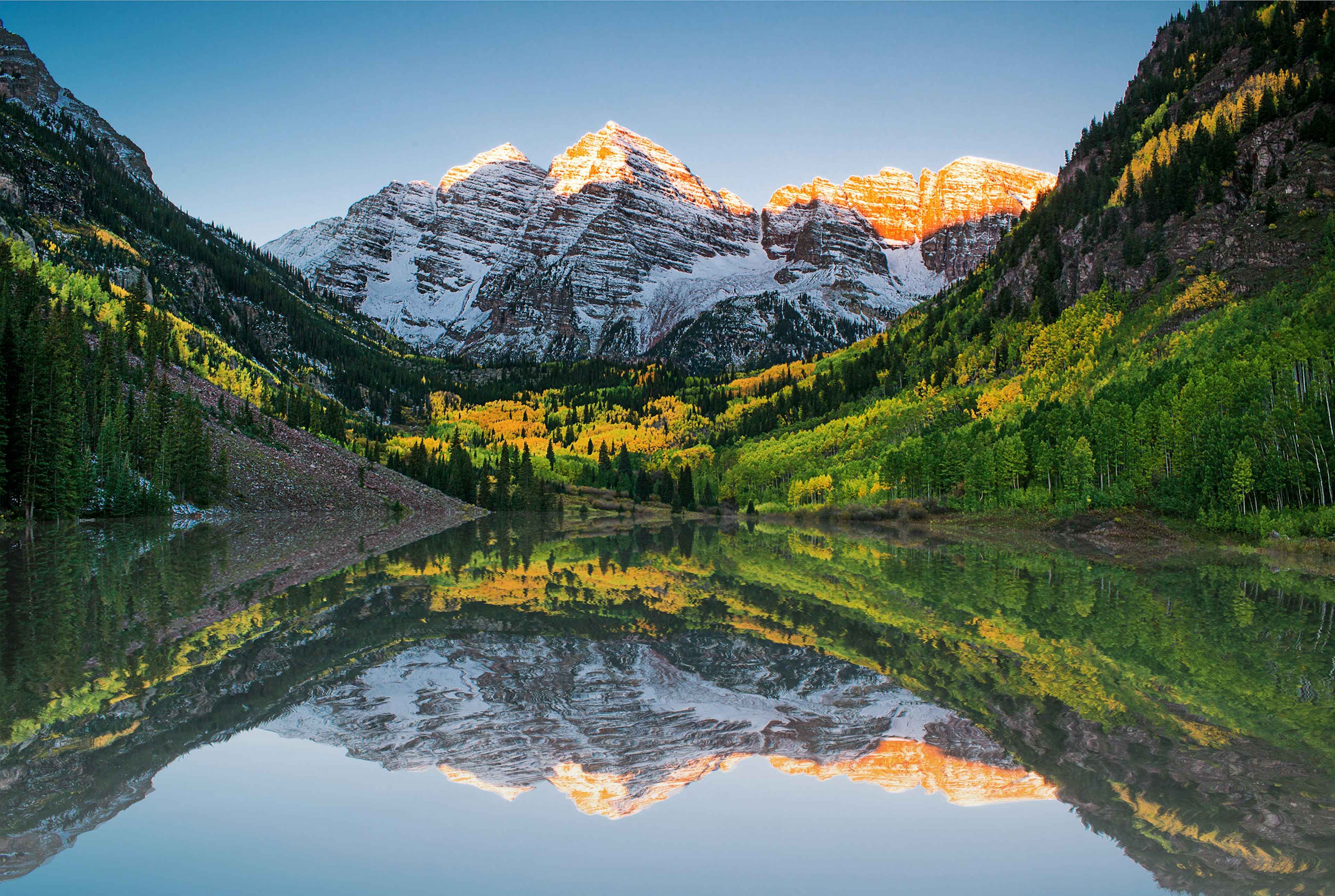 Sunrise and reflections at Maroon Bells lake