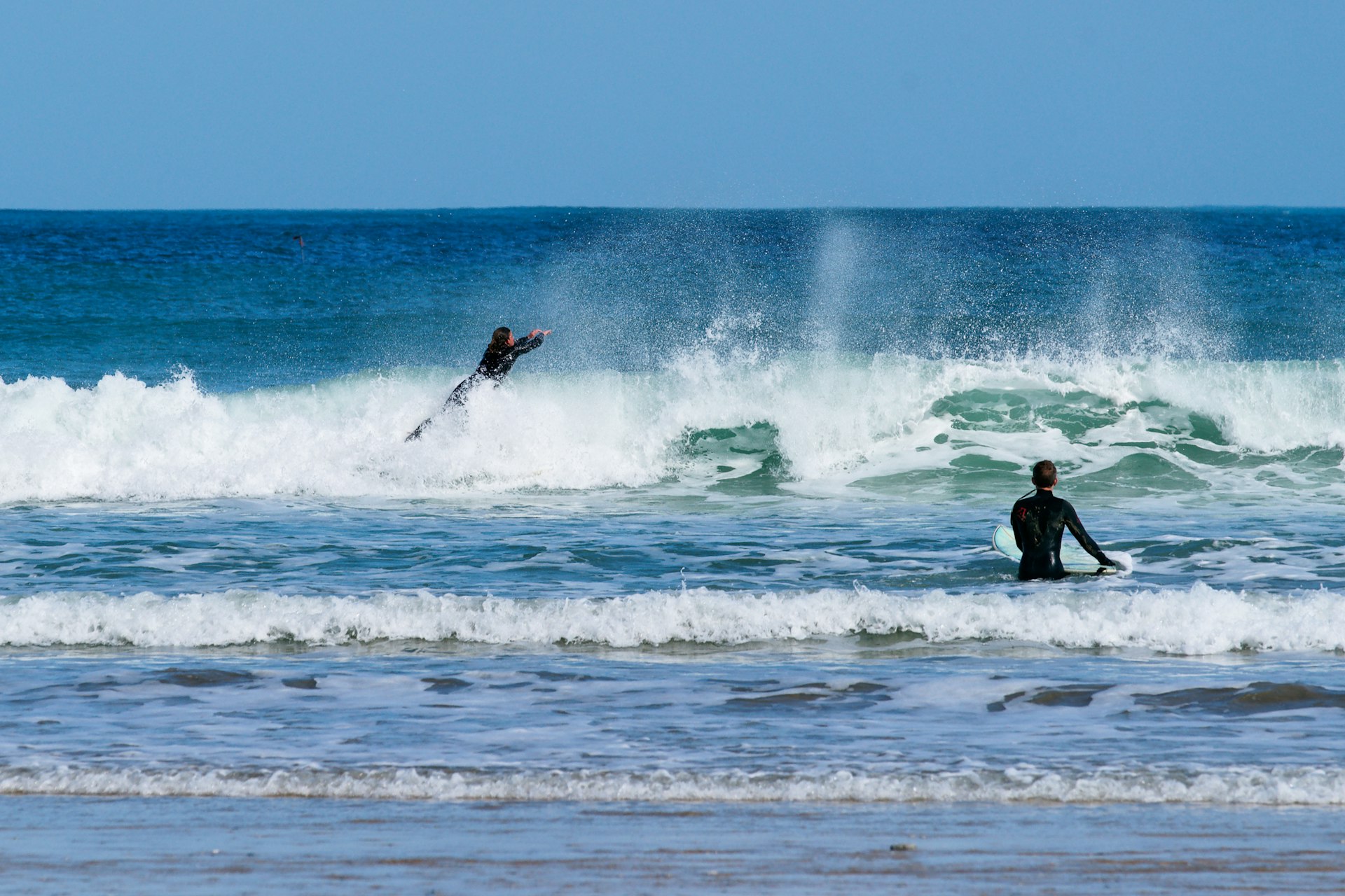 Surfing at Newquay beach in Cornwall