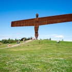 AUGUST 13th, 2015: Visitors at the Angel of the North, a steel sculpture by Antony Gormley, which stands 20 meters high.