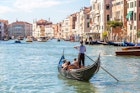 Gondola on Canal Grande in Venice on a summer day.