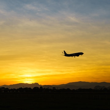 Horizon at sunset with aeroplane.