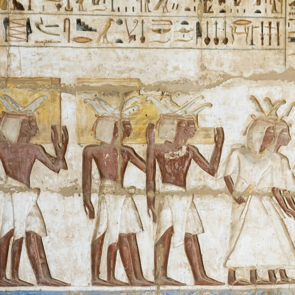 Hieroglyph color of a religious service in the temple at medinet habu in Luxor Egypt