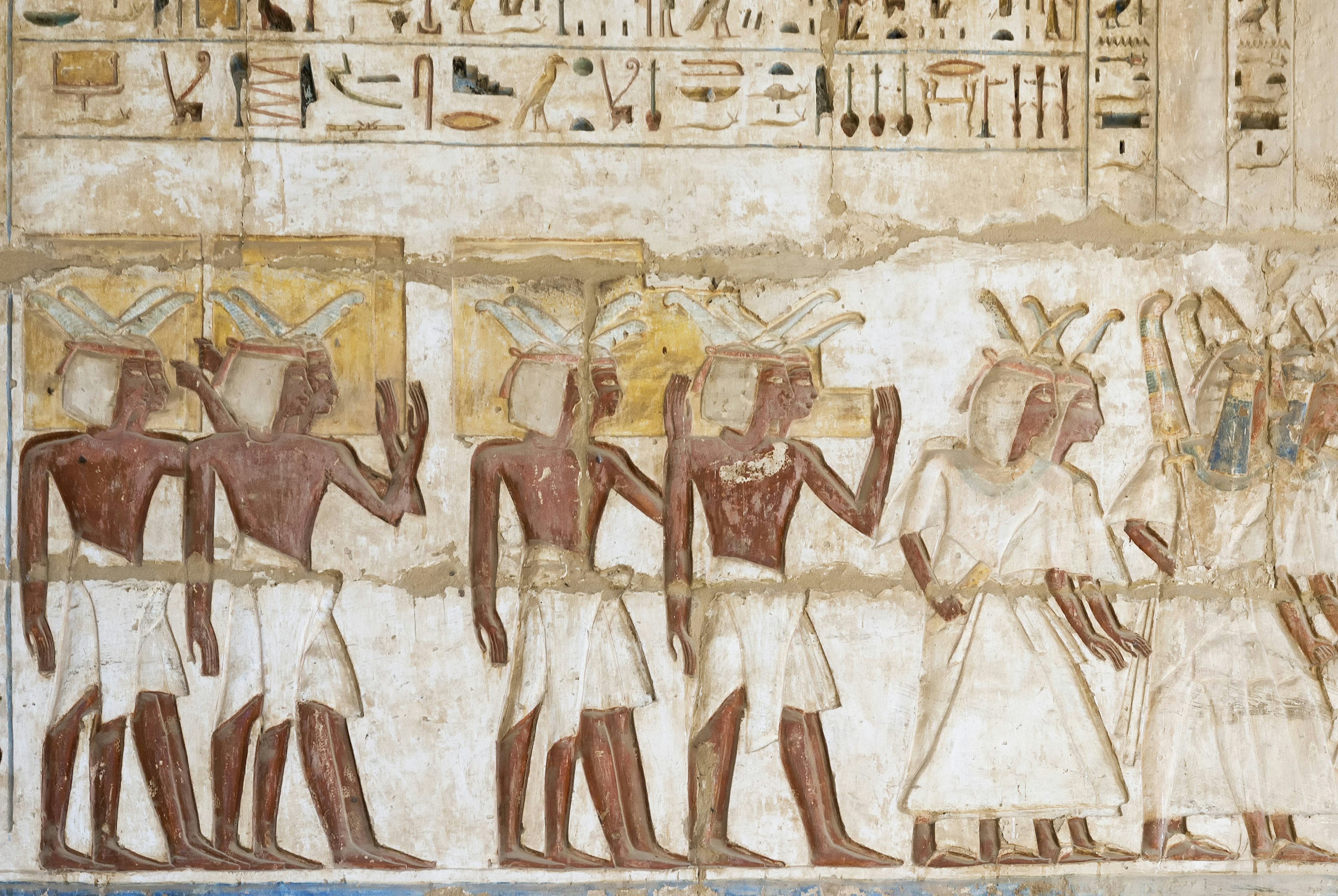 Hieroglyph color of a religious service in the temple at medinet habu in Luxor Egypt