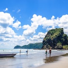 Auckland,New Zealand - March 3,2016 : People can seen exploring and relaxing around Piha beach,which is located at the West Coast in Auckland,New Zealand..
