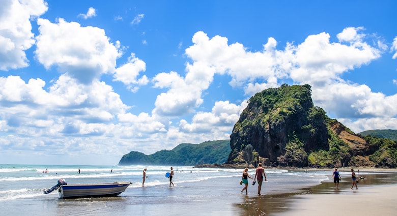 Auckland,New Zealand - March 3,2016 : People can seen exploring and relaxing around Piha beach,which is located at the West Coast in Auckland,New Zealand..