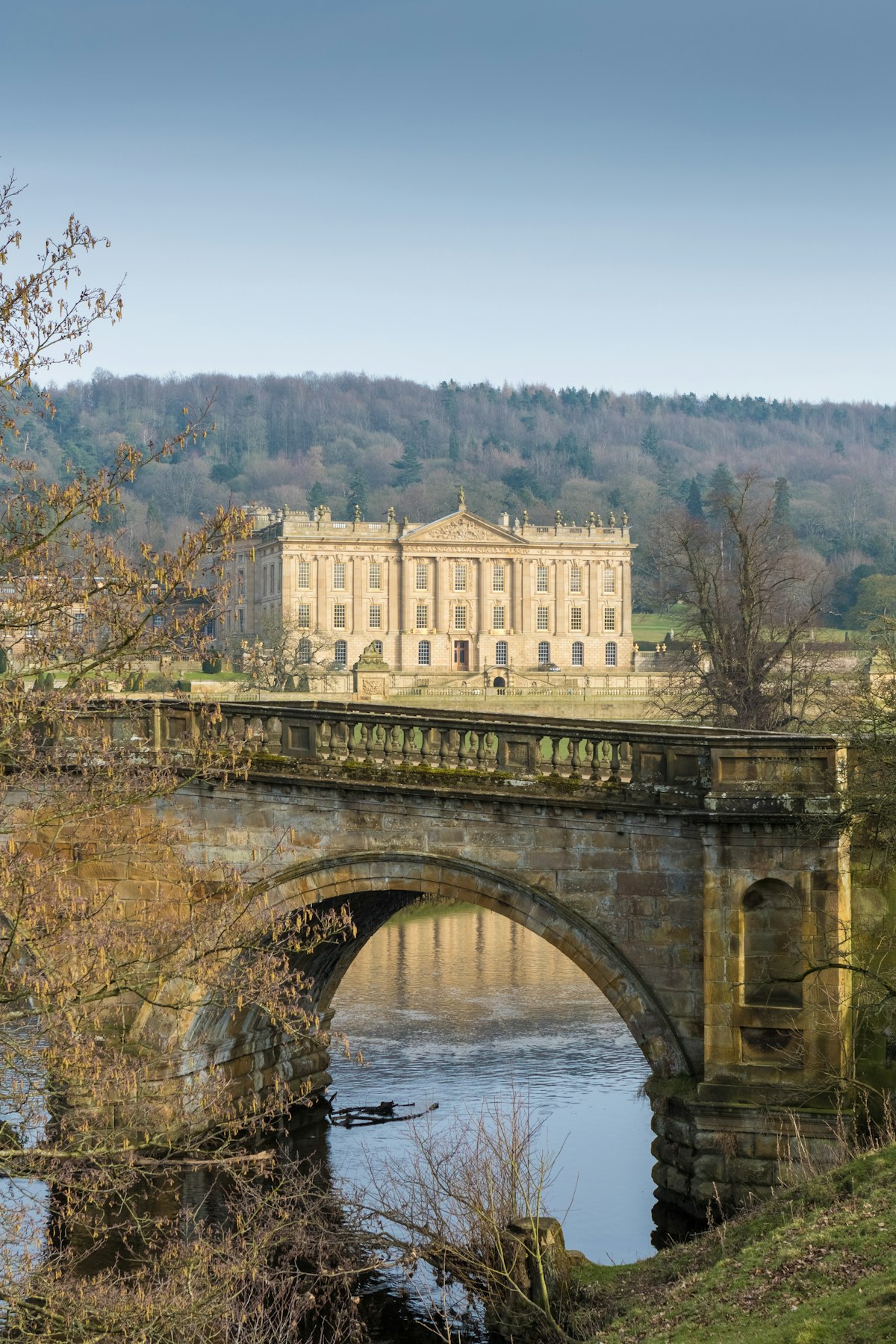 MARCH 15, 2016: Chatsworth House reflected in a lake in Derbyshire.