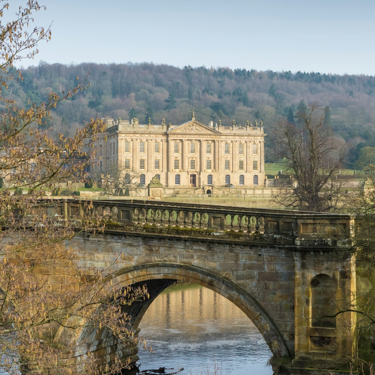 MARCH 15, 2016: Chatsworth House reflected in a lake in Derbyshire.