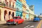 HAVANA,CUBA - MAY 26,2016 : Street scene with old cars and colorful buildings in Old Havana