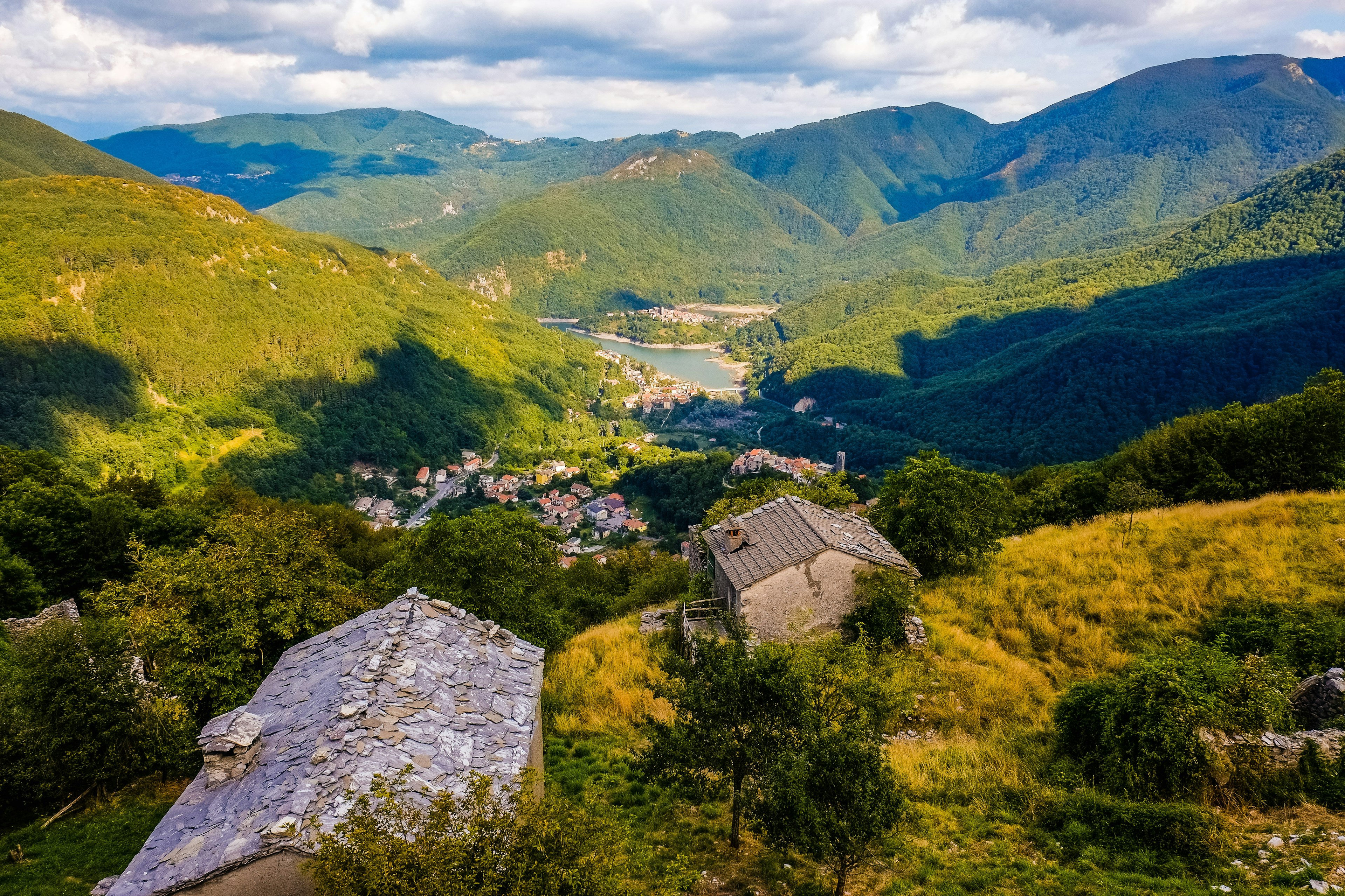 A panoramic shot of Lake Vagli and the valley around it