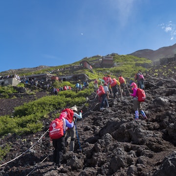 MOUNT FUJI, YAMANASHI, JAPAN - JULY 17, 2016 : Crowds of climbers are climbing to the summit of Mount Fuji in Chubu region, Honshu, Japan.