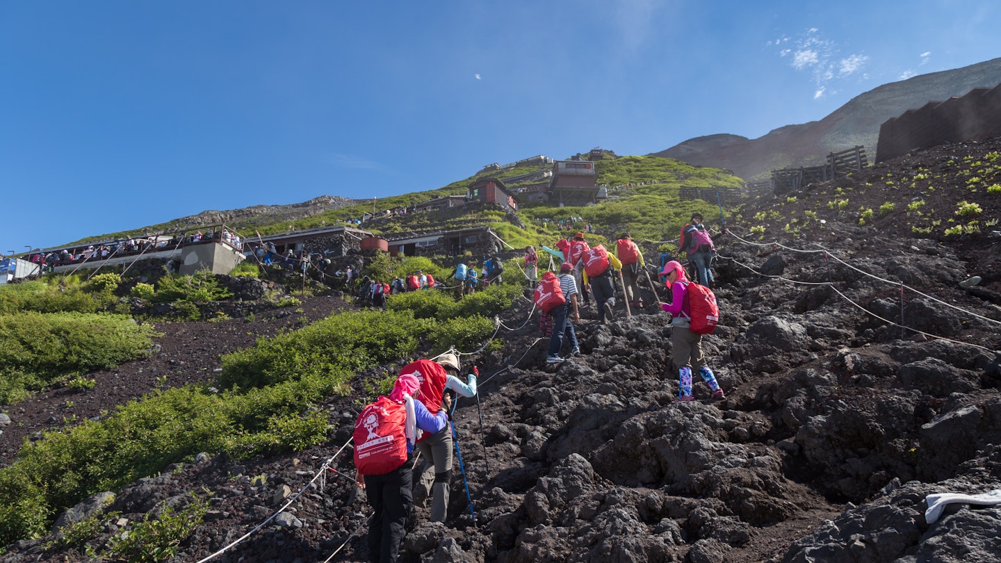MOUNT FUJI, YAMANASHI, JAPAN - JULY 17, 2016 : Crowds of climbers are climbing to the summit of Mount Fuji in Chubu region, Honshu, Japan.