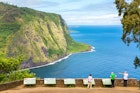 Group of tourists enjoying the amazing view in Waipio Valley, Big Island, Hawaii, Usa