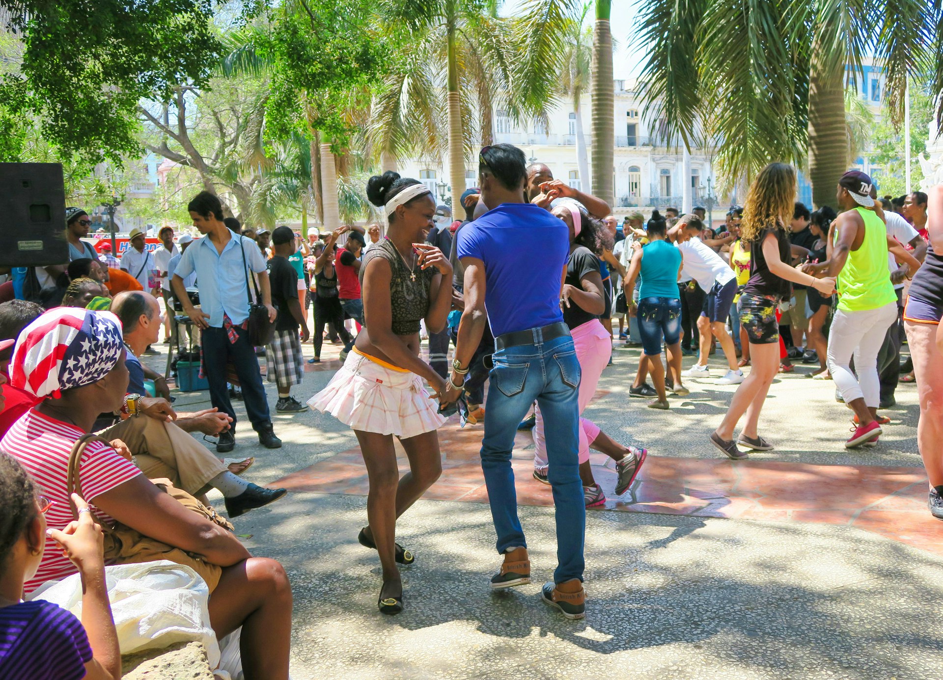 People salsa-dancing in the street near one of Havana's central squares 