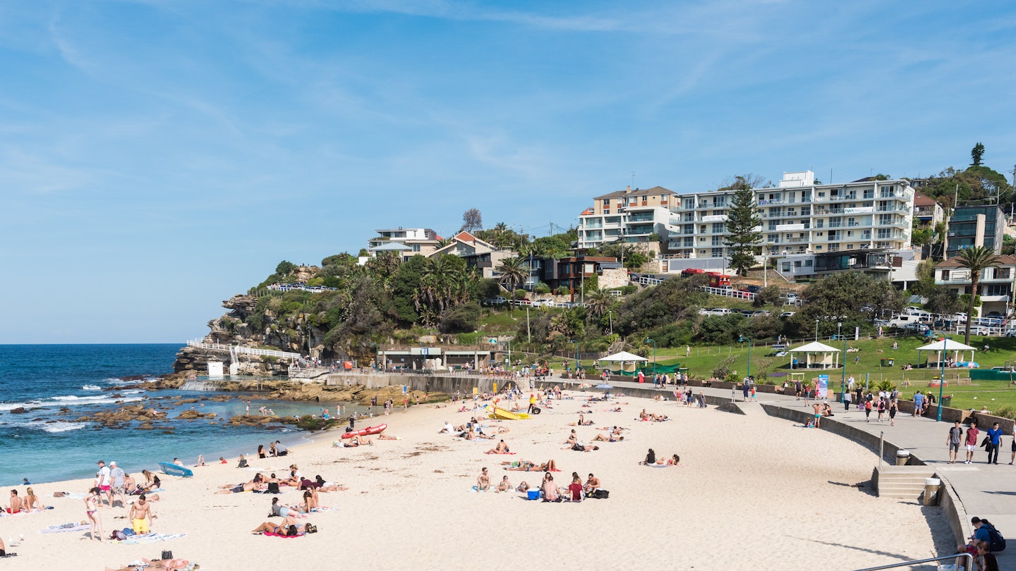 Sydney, Australia - April 9, 2016: Bronte beach along the Bondi to Coogee coastal walk.  A cliff top coastal walk featuring stunning views, beaches, parks, cliffs, bays and rock pools.