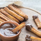 Churros - a Spanish dessert with chocolate dipping sauce.