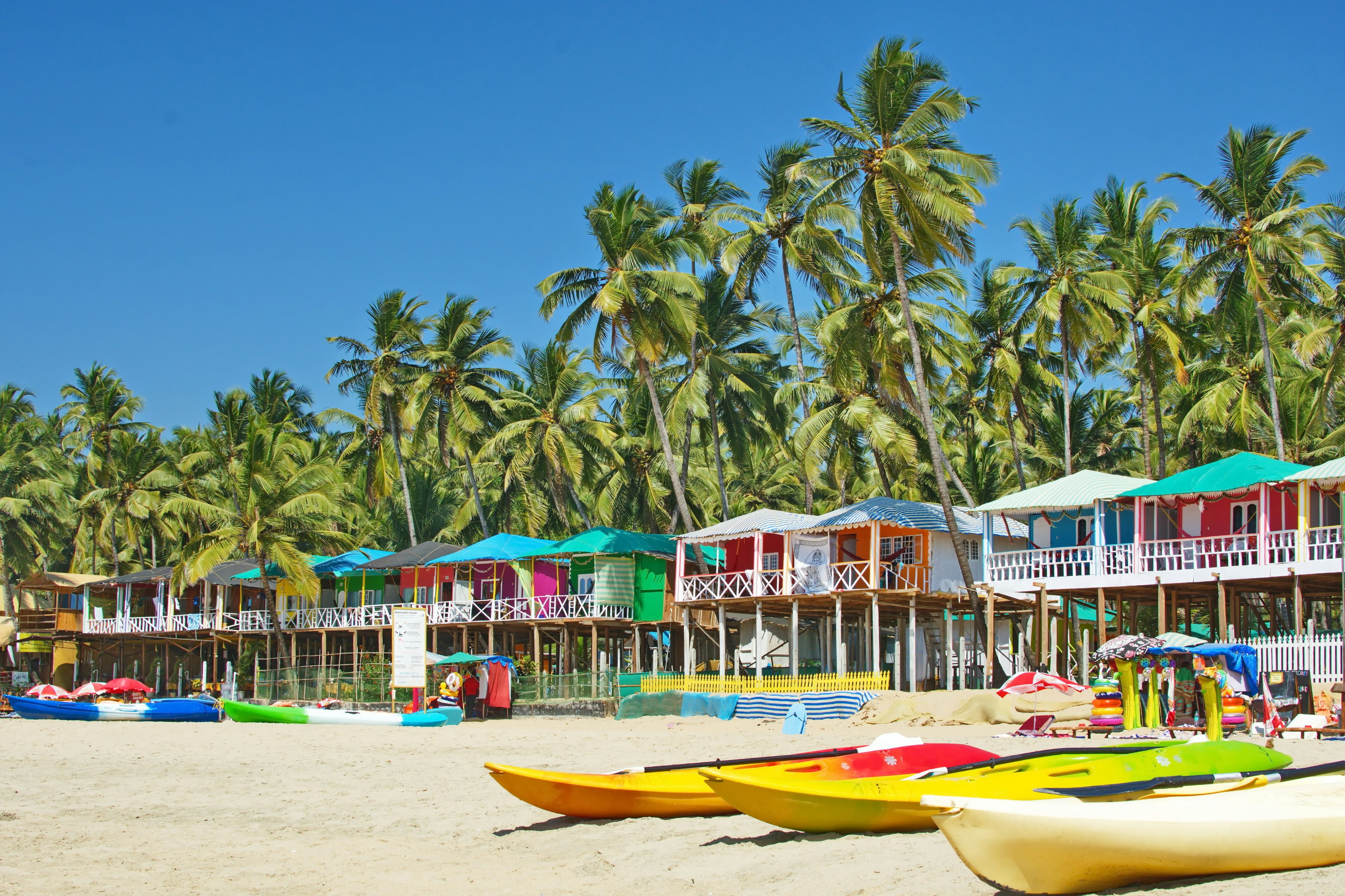 Palolem beach Southern Goa, India colorful sea front bungalows landscape