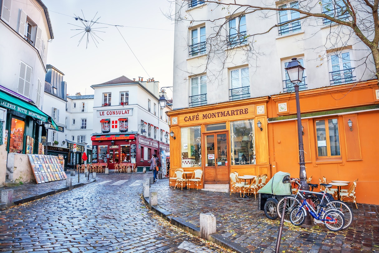 DECEMBER 11, 2016: a French street in the Montmartre district with small cafes, restaurants and art galleries.