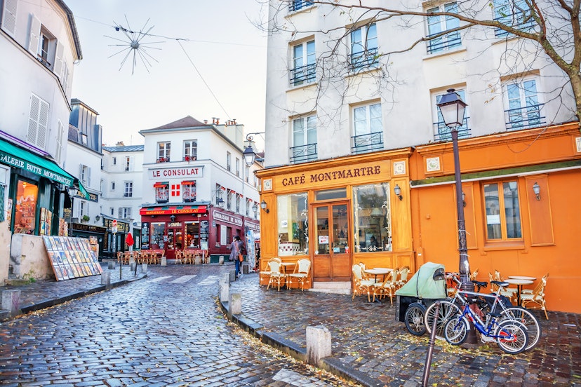 DECEMBER 11, 2016: a French street in the Montmartre district with small cafes, restaurants and art galleries.