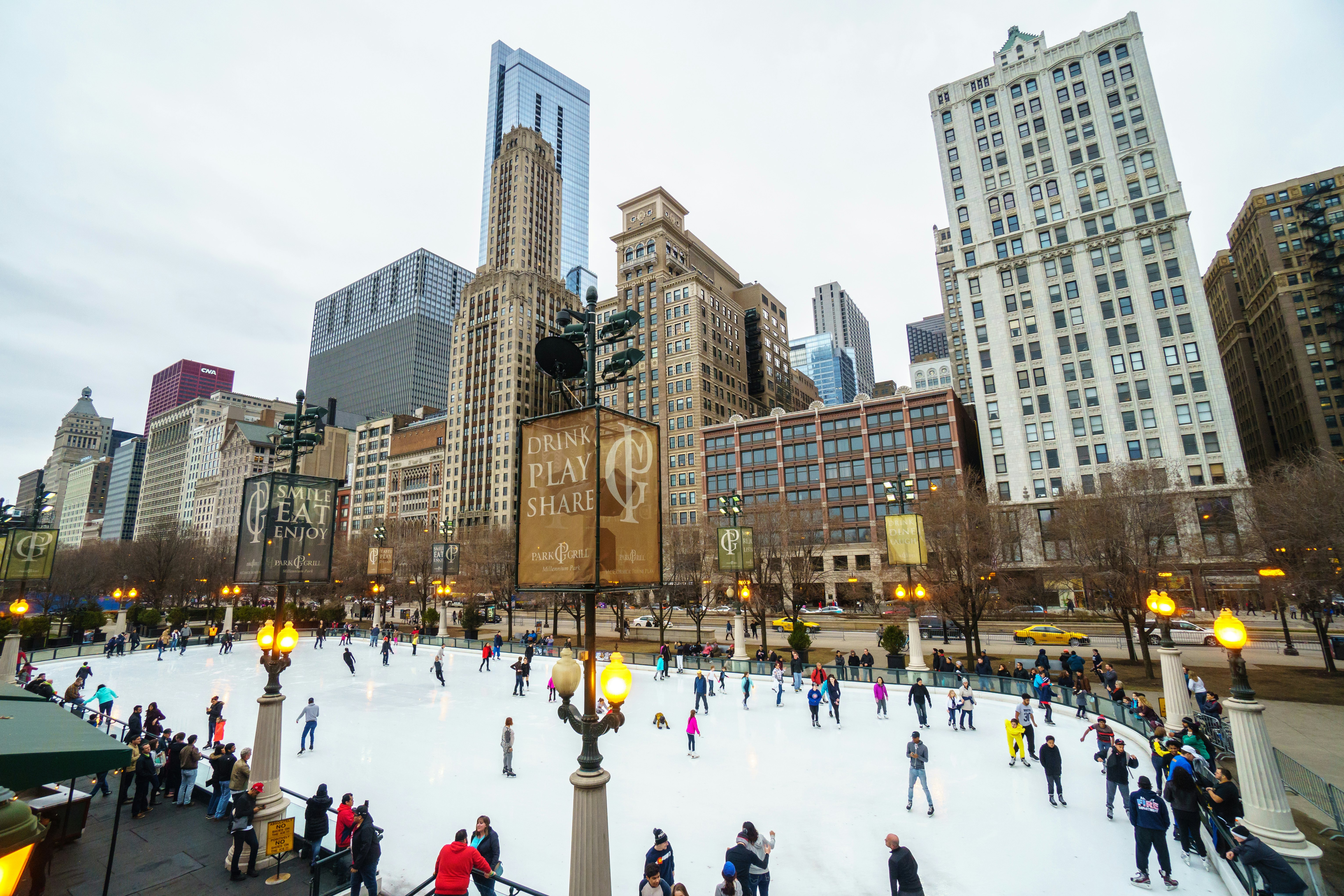 People ice skating at McCormick Tribune Plaza in Chicago.