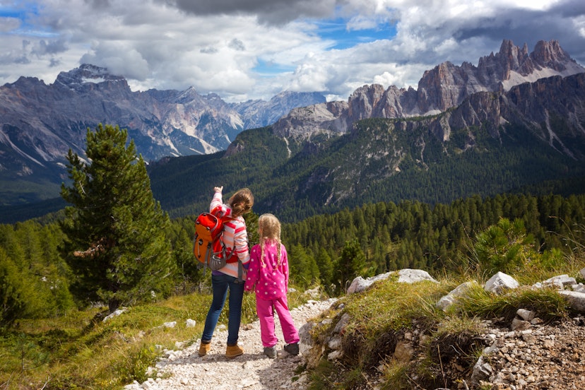 two sisters girls hikers at the mountains Dolomites, Italy. Cinque Torri