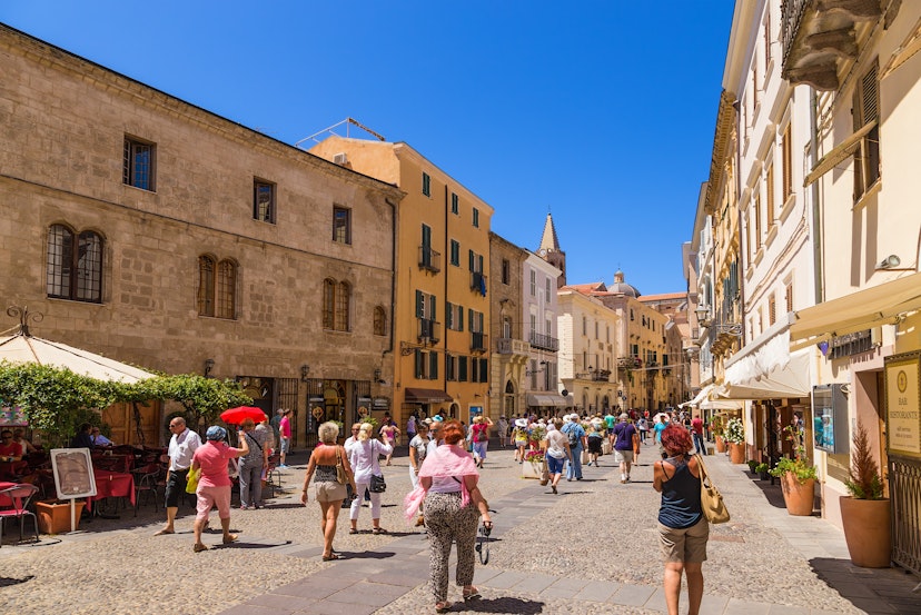 ALGHERO, SARDINIA, ITALY - JUL 07, 2016: Tourists on the street in the old town