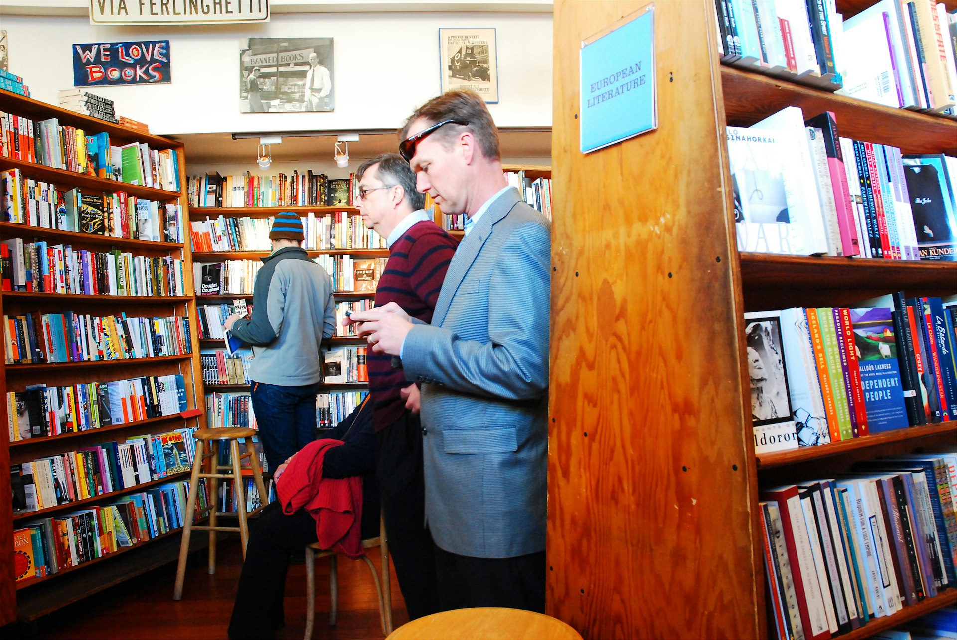People browse through the shelves of a bookstore. 