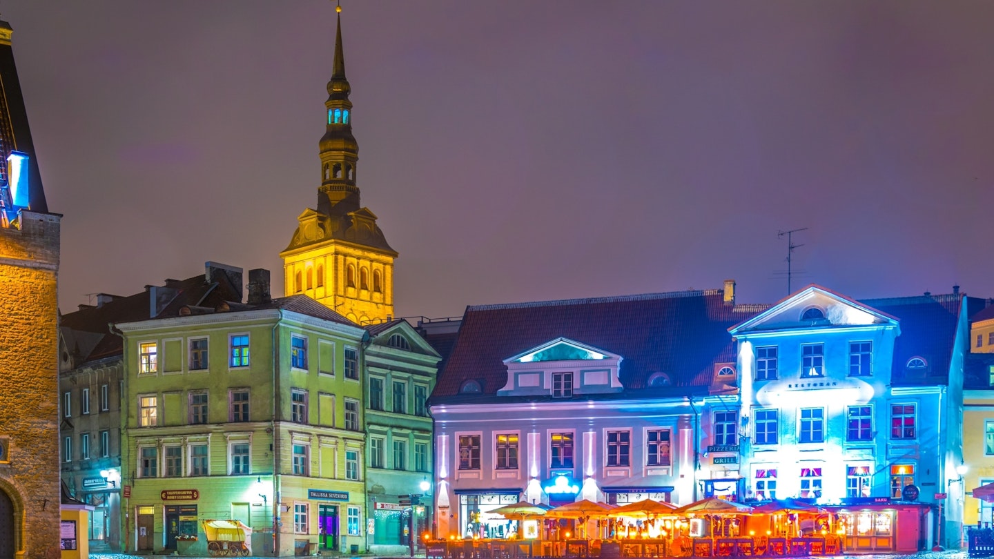 AUGUST 16, 2016: brightly lit restaurants surrounding the town hall square in the old town of Tallin at night.