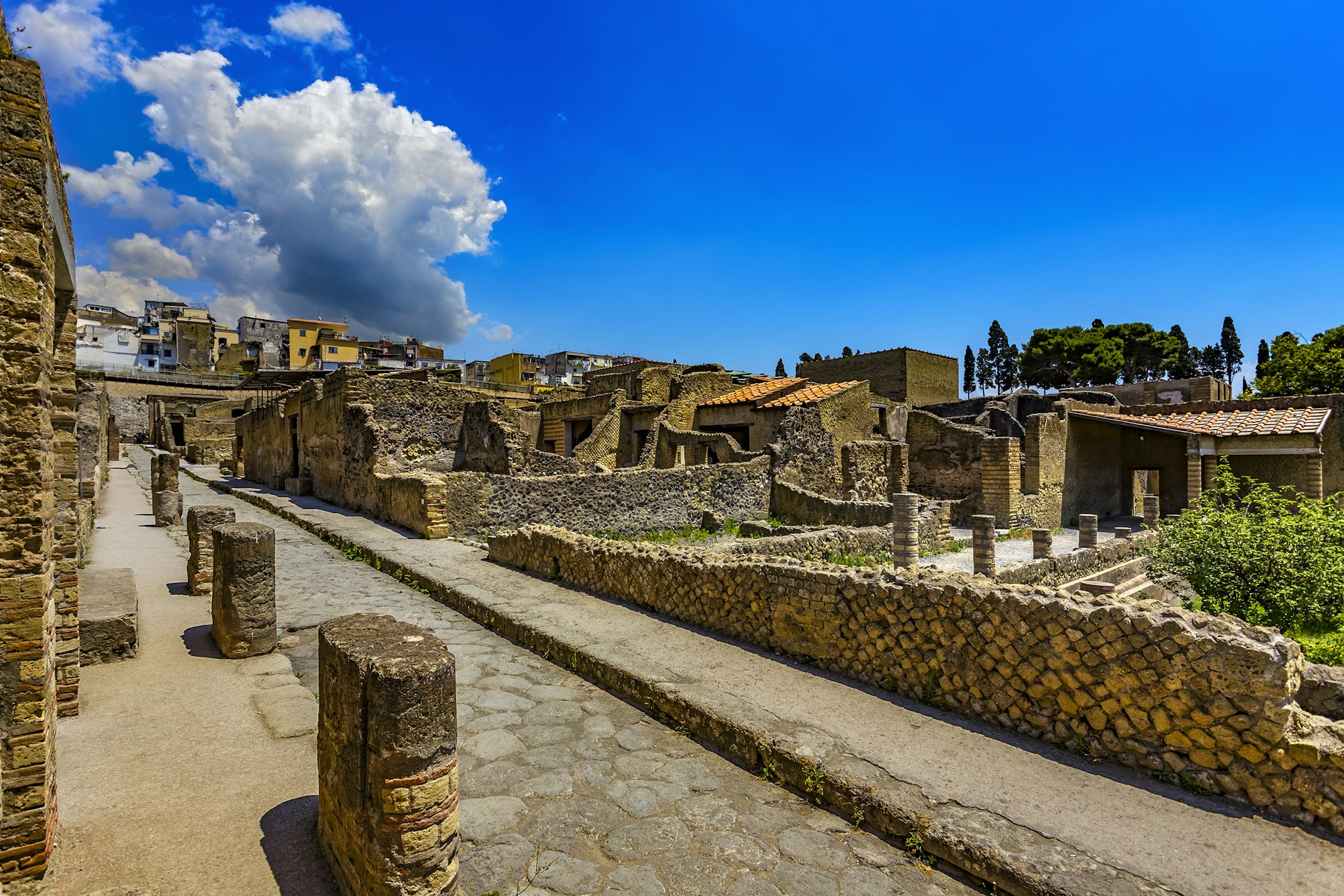 Ruined walls and pillars of the archaeological site at Herculaneum