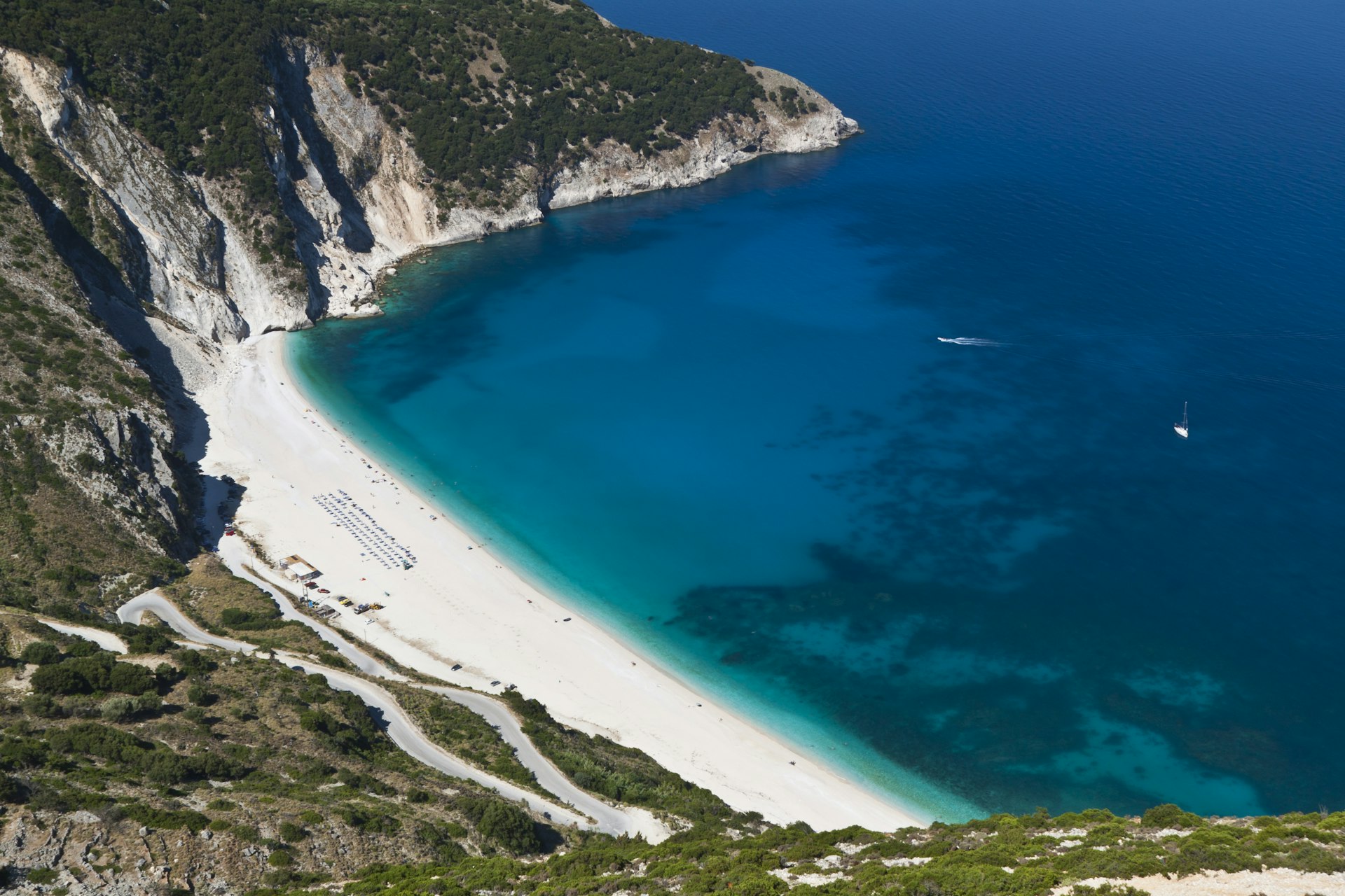 Aerial view of Myrtos Beach with white sand and light blue waters in Kefallonia, Greece 