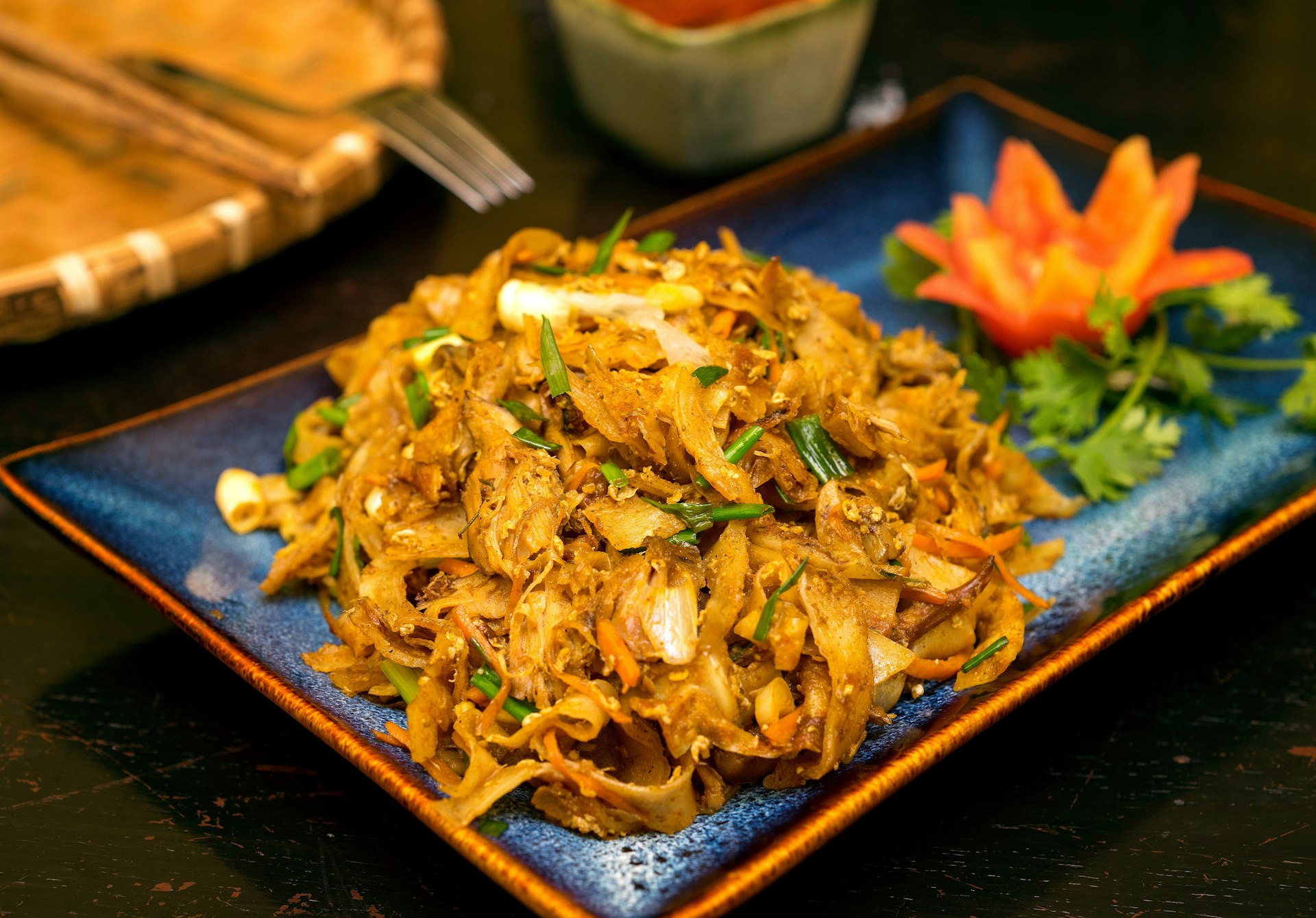 Traditional Sri Lankan kottu roti in wooden background.