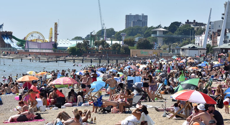 SOUTHEND-ON-SEA, ENGLAND - JUNE 25: A general view of as crowds of people gather on the beach on June 25, 2020 in Southend-on-Sea, England. The UK is experiencing a summer heatwave, with temperatures in many parts of the country expected to rise above 30C and weather warnings in place for thunderstorms at the end of the week. (Photo by John Keeble/Getty Images)