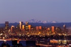 Denver city skyline photographed before sunrise with Pikes Peak Behind