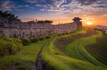 Hwaseong Fortress at sunset, Traditional Architecture of Korea at Suwon, South Korea.