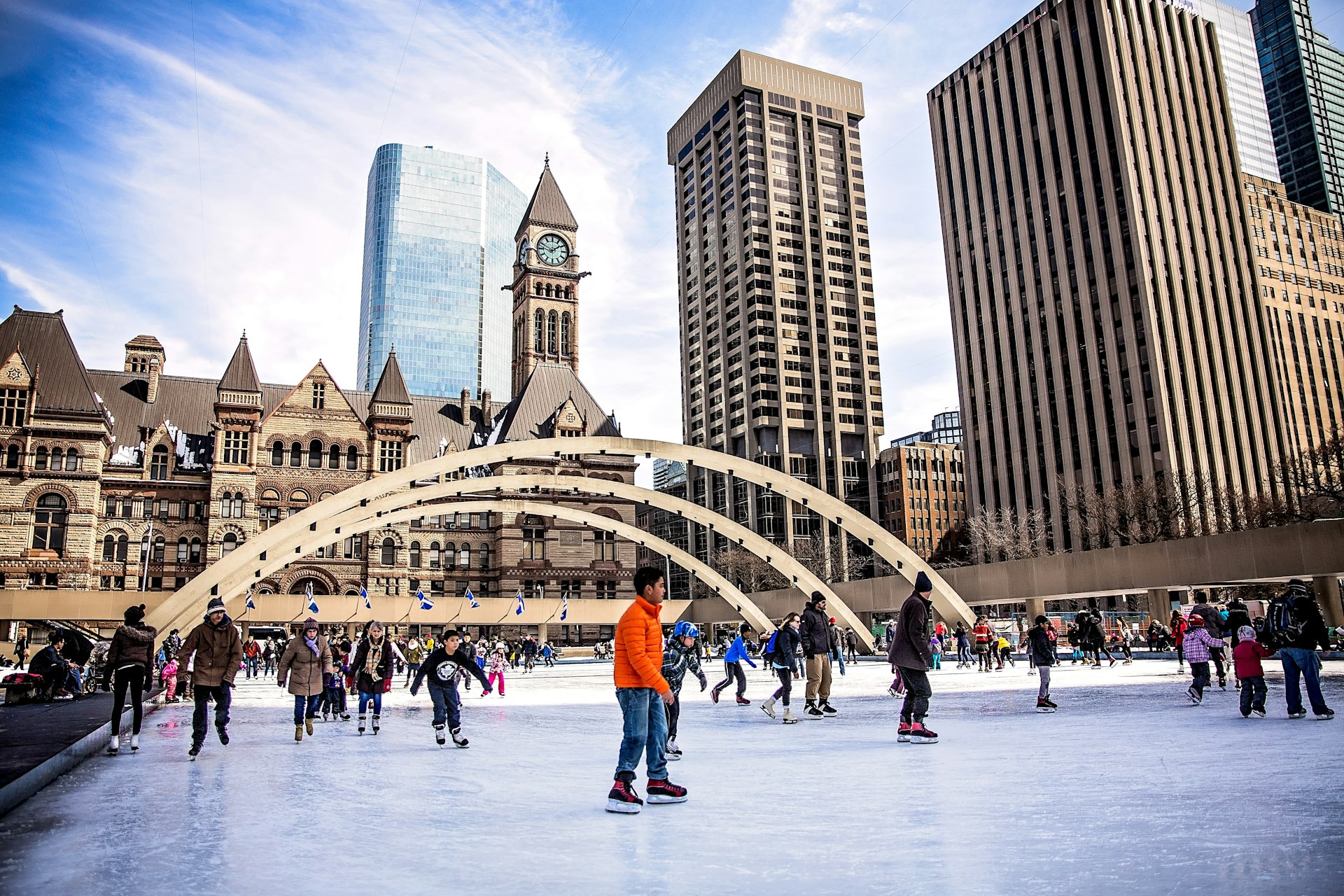 Children ice skating in an urban park