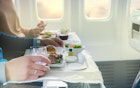 Tasty meal served on board of airplane on the table