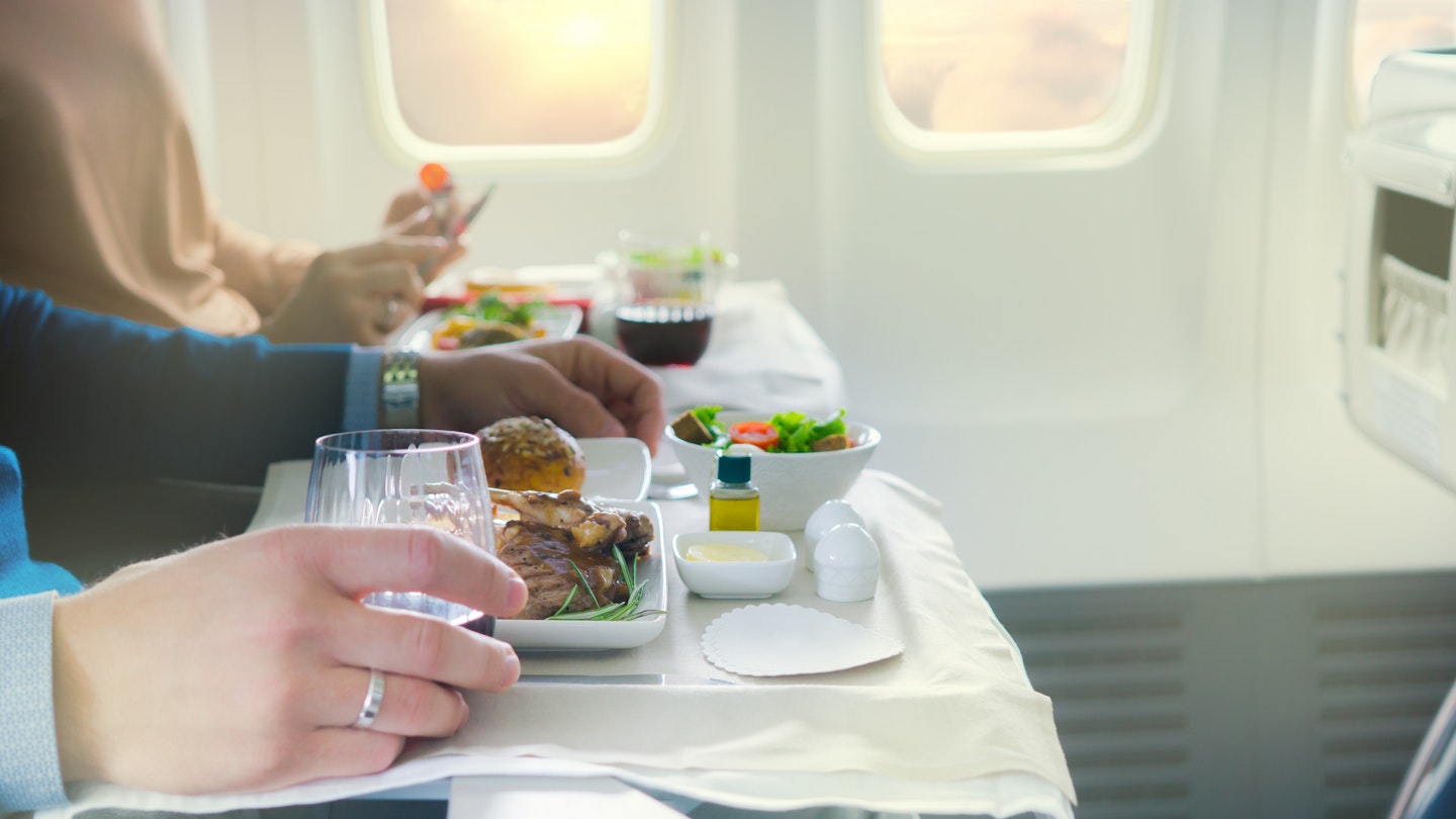 Tasty meal served on board of airplane on the table