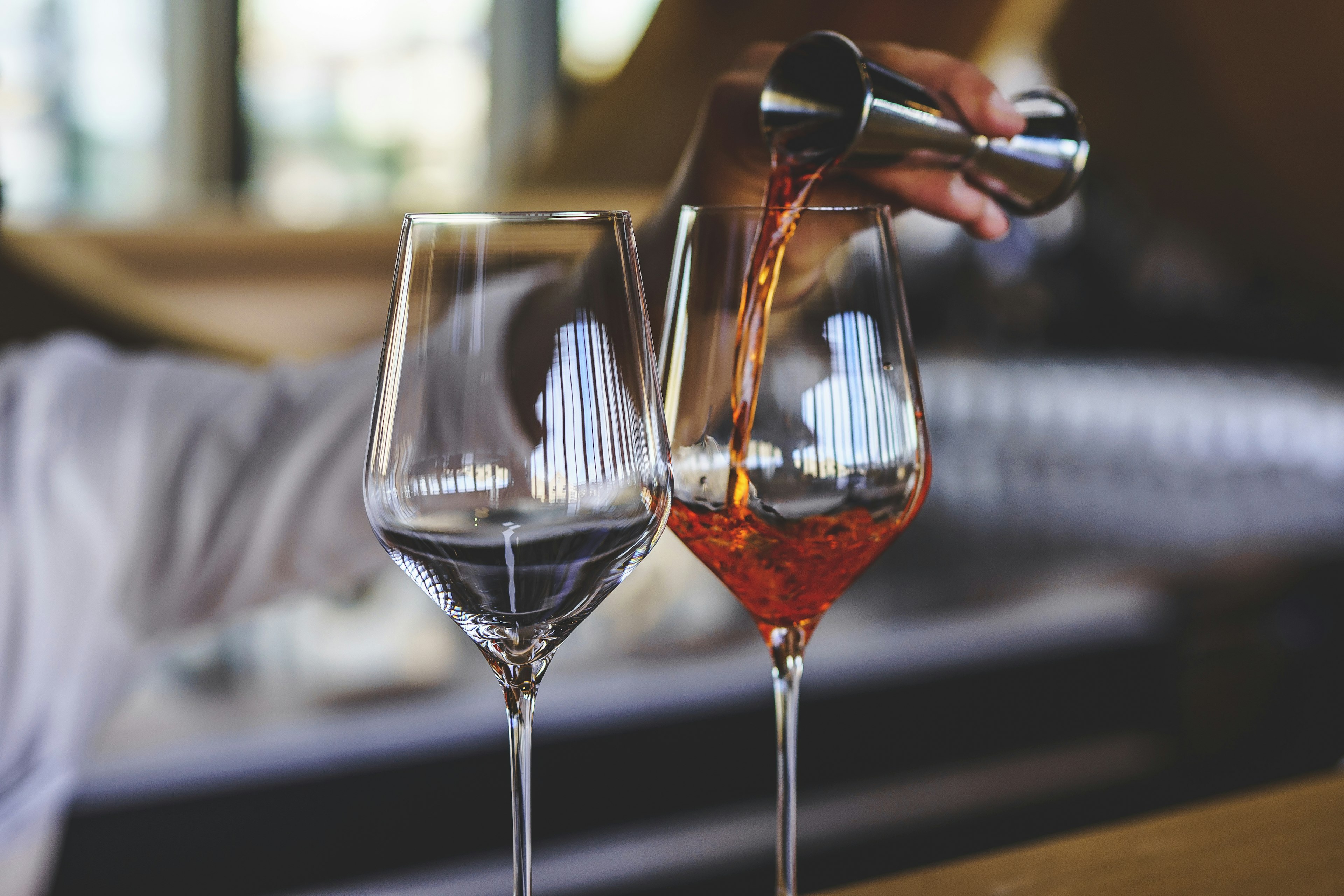 Port and red wine are poured into glasses