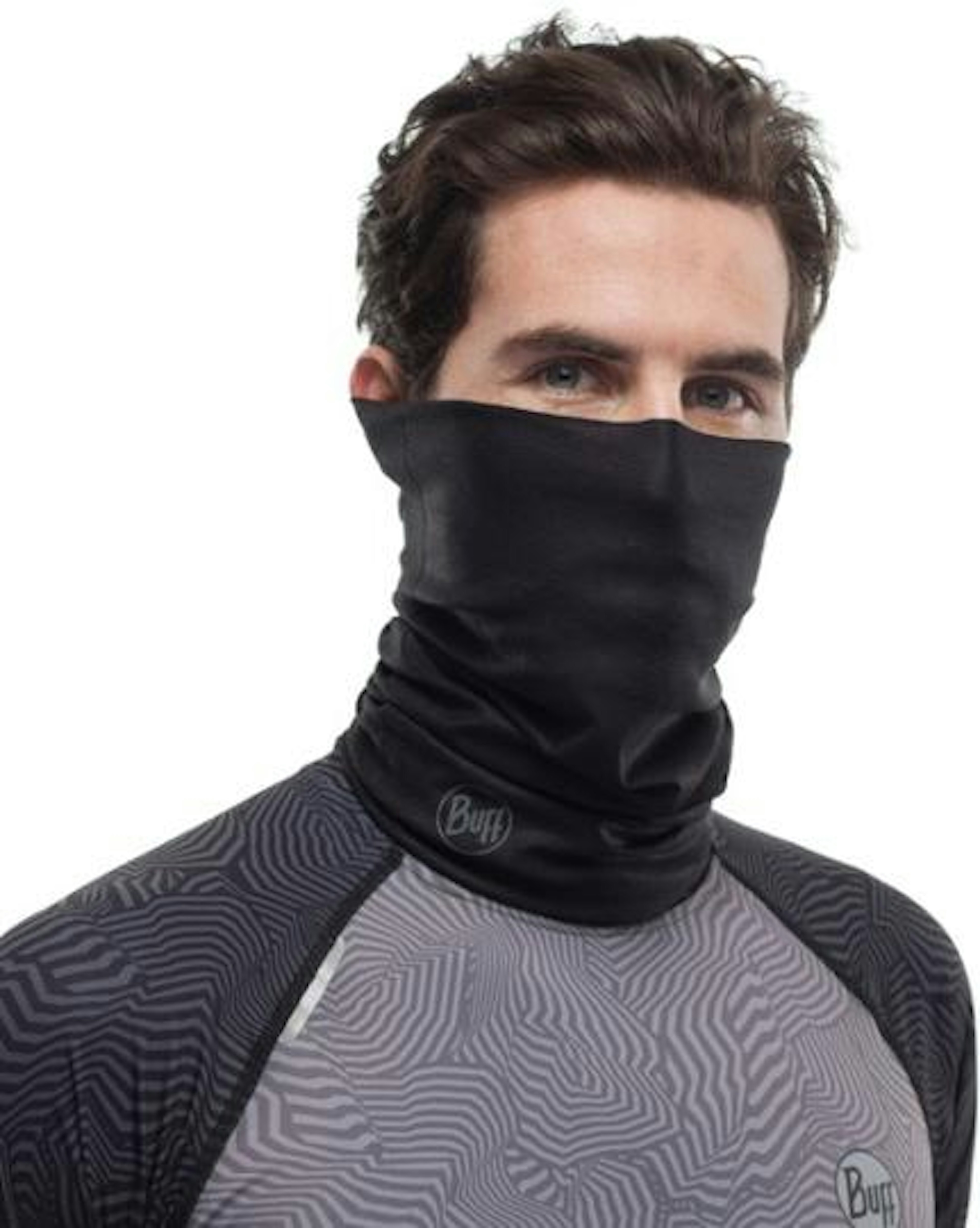 A white male model wears a black tube scarf that covers his neck, chin and nose