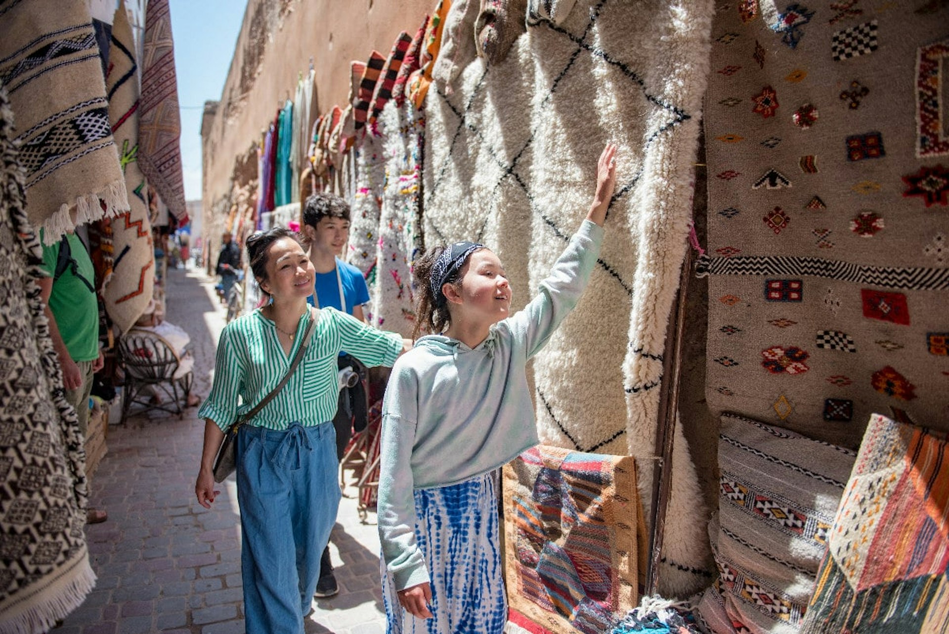 Women looking at Berber rugs in Marrakech