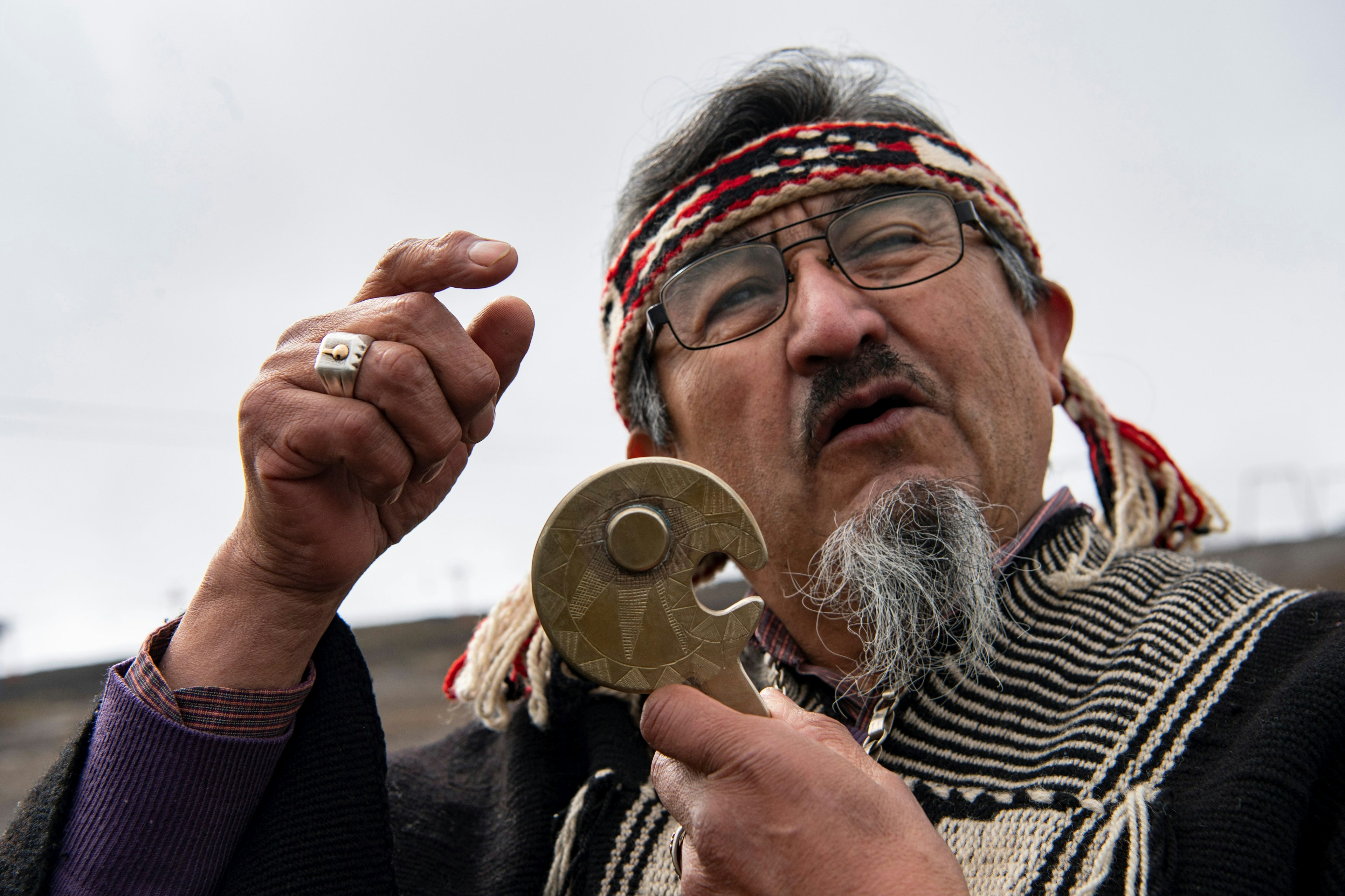 Mapuche sage Juan Nanculef performs a Mapuche ritual of greeting Villarrica volcano before the solar eclipse