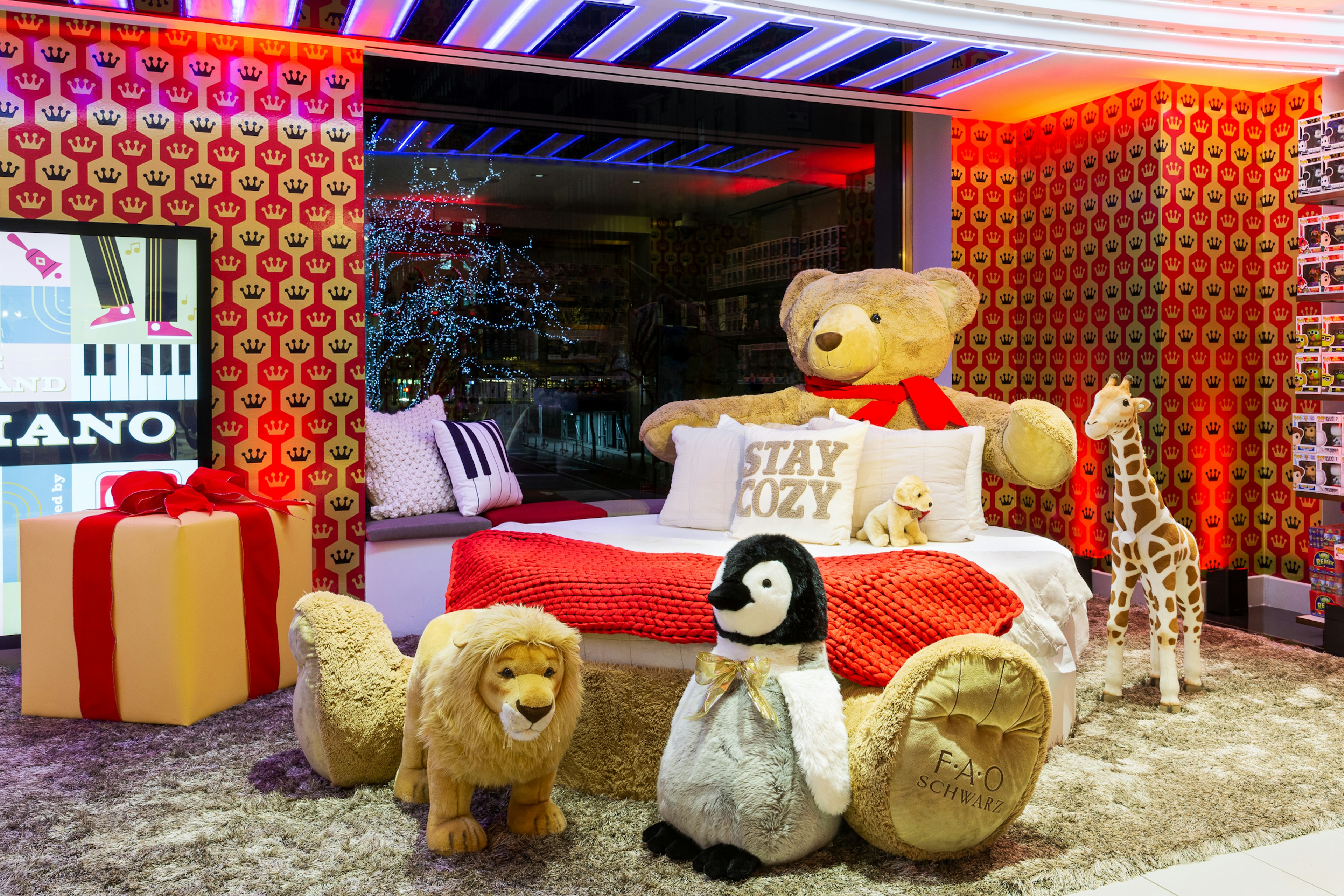 A teddy-bear shaped sleigh bed in FAO Schwarz