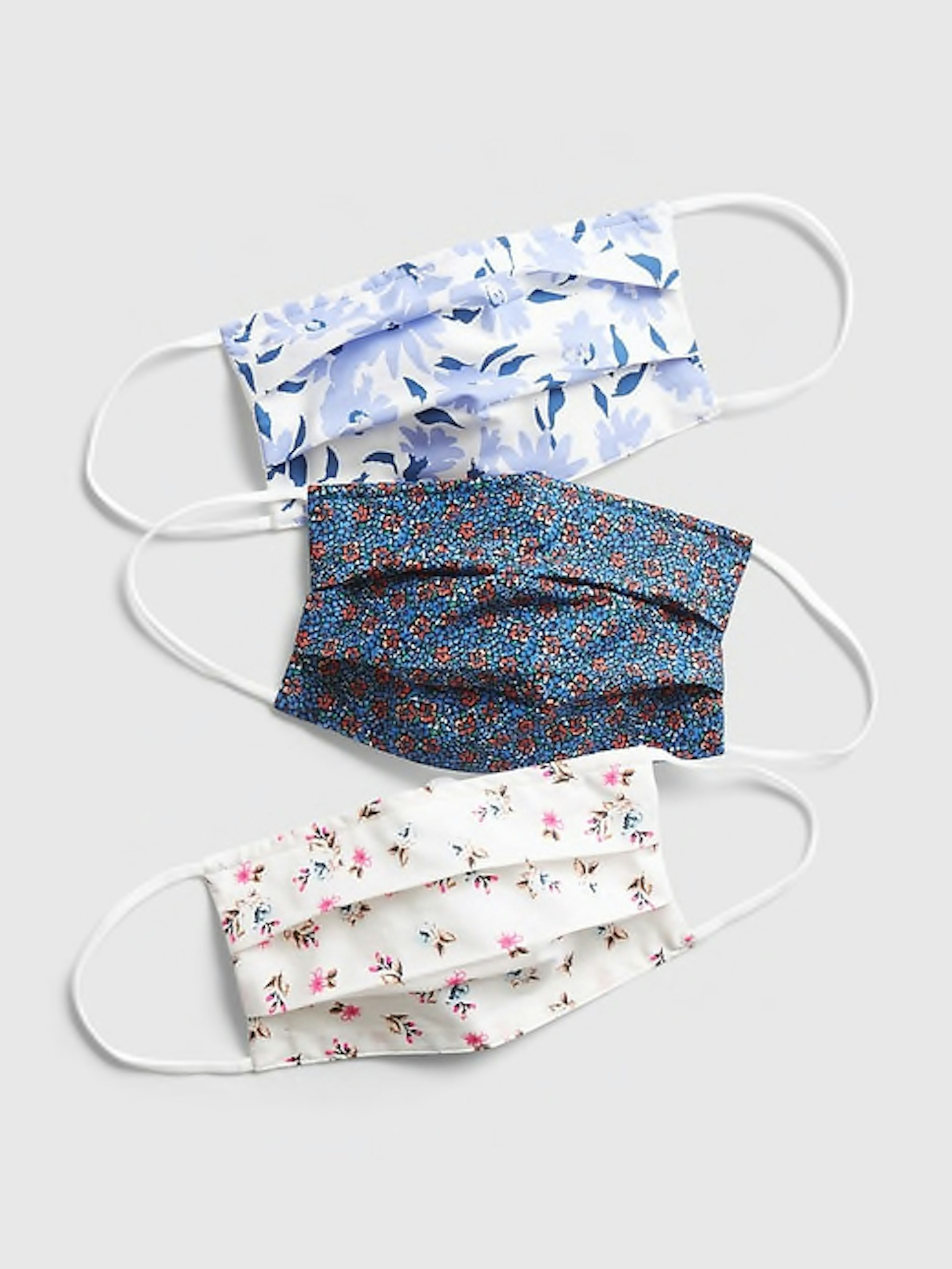 Three face masks with floral patterns