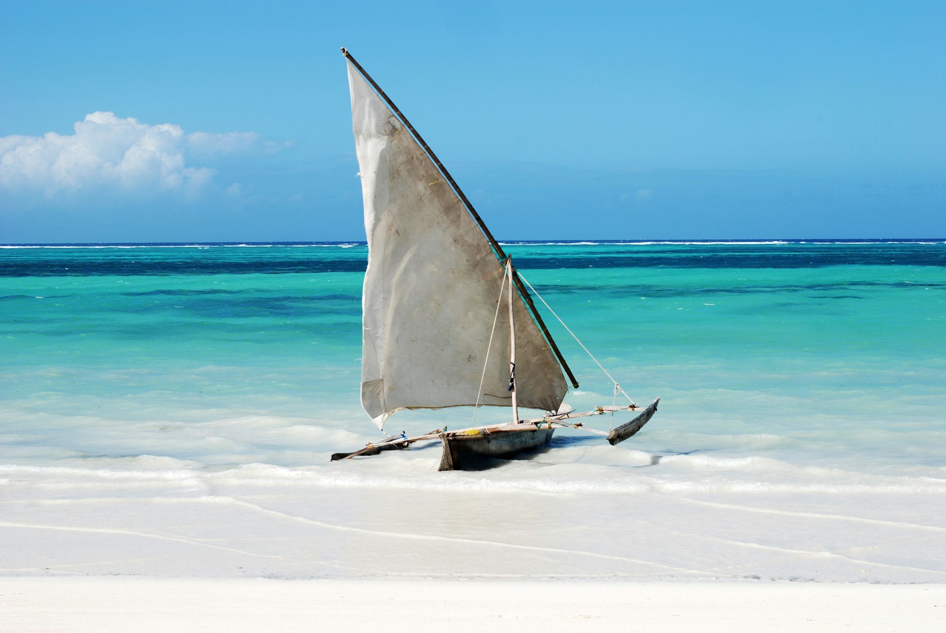 A traditional sailing boat on a beach in Zanzibar