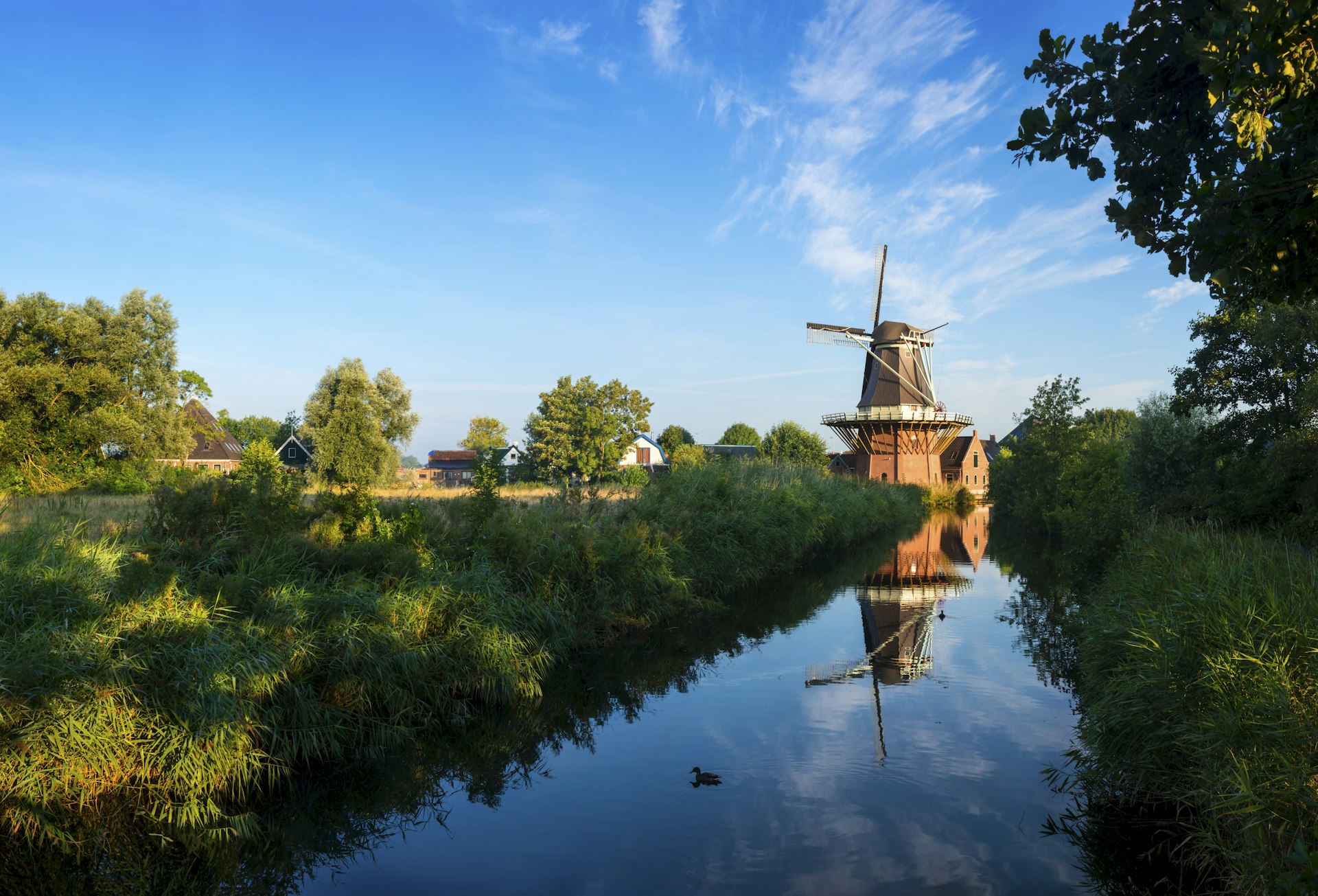 Traditional Dutch windmill along a canal near Alkmaar, Netherlands