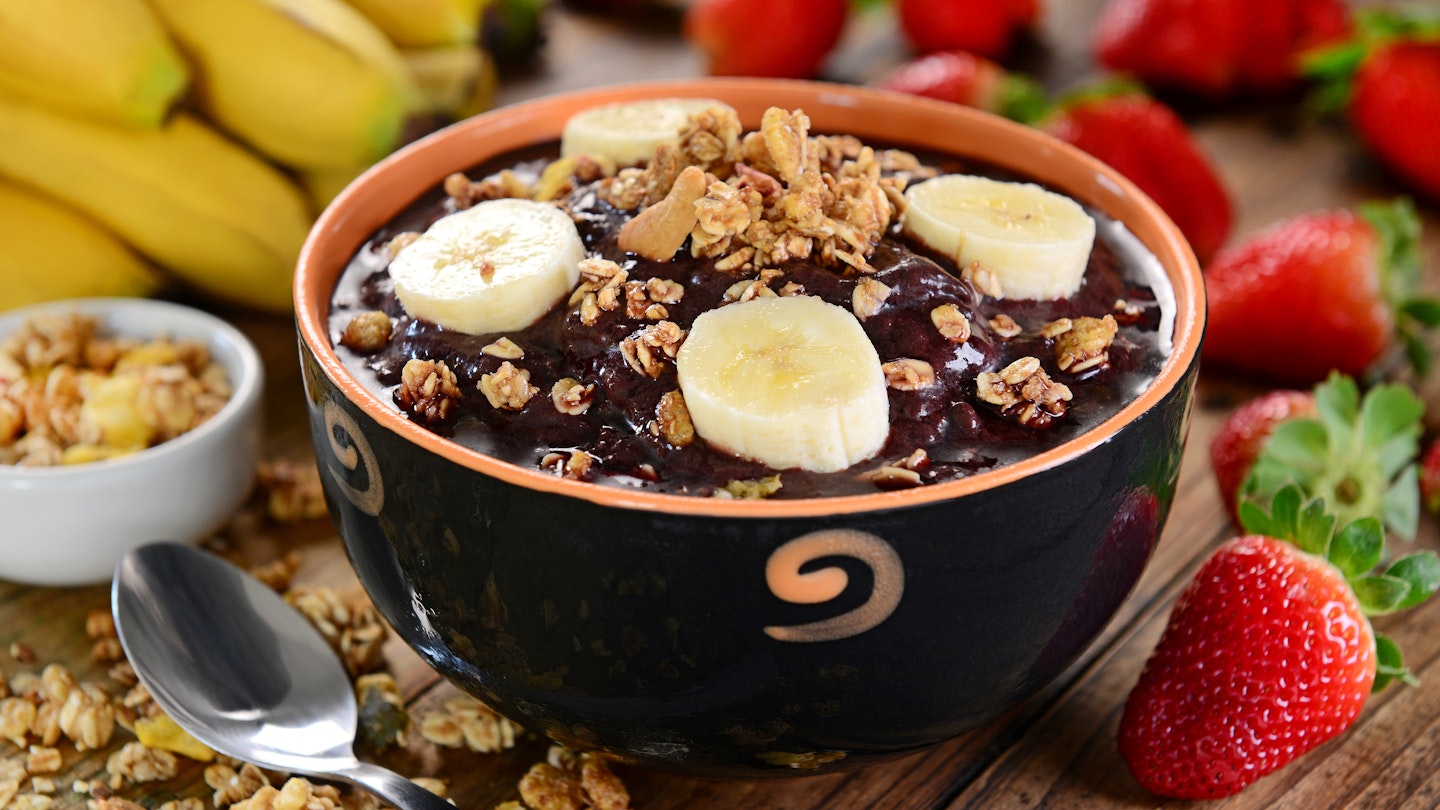 Typical Brazilian berry fruit served in a bowl with banana slices and granola