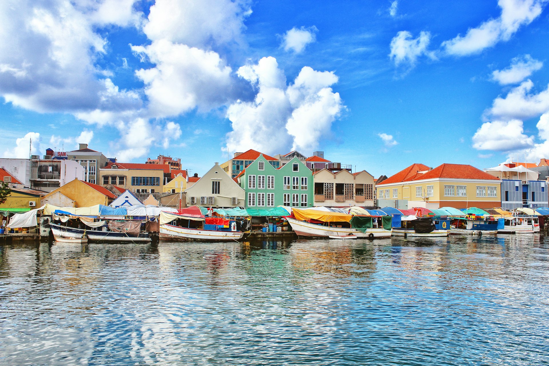Boats on the water at the floating market in Willemstad, Curaçao